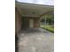Spacious covered back porch made of concrete and brick with view of backyard and fence at 615 Burcale Road Circle, Myrtle Beach, SC 29579