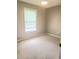 Standard carpeted bedroom featuring a window with blinds and neutral walls at 615 Burcale Road Circle, Myrtle Beach, SC 29579