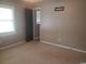 Comfortable bedroom with neutral carpet, a window providing natural light, and ample closet space at 615 Burcale Road Circle, Myrtle Beach, SC 29579