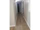 Hallway with wood-look flooring and neutral paint, connecting various rooms in the home at 615 Burcale Road Circle, Myrtle Beach, SC 29579