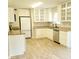 Bright kitchen features granite countertops, stainless steel appliances, and abundant cabinet space at 615 Burcale Road Circle, Myrtle Beach, SC 29579