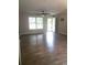 Bright and airy living room featuring sleek wood floors and a modern ceiling fan at 615 Burcale Road Circle, Myrtle Beach, SC 29579