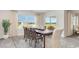 Bright dining area featuring a spacious table and sliding door to the patio at 619 Culmen Ct., Myrtle Beach, SC 29588