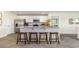 Stylish kitchen island with seating, stainless steel appliances, and open floor plan at 619 Culmen Ct., Myrtle Beach, SC 29588