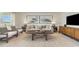 Cozy living room features comfortable seating, stylish decor and plenty of natural light at 619 Culmen Ct., Myrtle Beach, SC 29588
