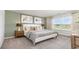 Relaxing main bedroom featuring soft lighting, neutral tones, and comfortable bedding at 619 Culmen Ct., Myrtle Beach, SC 29588