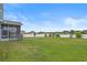 Large backyard with green lawn and a white vinyl fence for privacy at 713 Garland Ct., Myrtle Beach, SC 29588