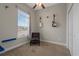 Neutral bedroom with an accent chair and guitars hung on the wall at 713 Garland Ct., Myrtle Beach, SC 29588