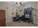 A bedroom setup as an office space, complete with a ceiling fan at 713 Garland Ct., Myrtle Beach, SC 29588