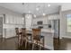 Bright kitchen features granite counters, white cabinets, stainless appliances and a breakfast bar at 713 Garland Ct., Myrtle Beach, SC 29588