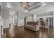 Open-concept living room with modern lighting, hardwood floors, and easy access to kitchen and entryway at 713 Garland Ct., Myrtle Beach, SC 29588