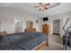 Large main bedroom with bed, TV, and access to the main bathroom at 713 Garland Ct., Myrtle Beach, SC 29588