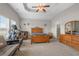 Spacious main bedroom with trey ceilings, a ceiling fan, and a stationary bike at 713 Garland Ct., Myrtle Beach, SC 29588