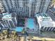 Aerial view of a condo community shows multiple swimming pools and landscaping at 7200 N Ocean Blvd. # 431, Myrtle Beach, SC 29572