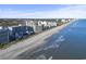 Lovely aerial shot of beachfront condos along a sandy coastline and the shimmering waters of the ocean at 7200 N Ocean Blvd. # 431, Myrtle Beach, SC 29572