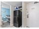 Bathroom area adjacent to a mini fridge with access to main door at 7200 N Ocean Blvd. # 431, Myrtle Beach, SC 29572