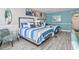 Comfortable bedroom featuring two beds with striped bedding, beach-themed décor, and a coastal vibe at 7200 N Ocean Blvd. # 431, Myrtle Beach, SC 29572