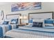 Bedroom showcasing two beds with striped bedding, coastal decor, and a nightstand with lamps at 7200 N Ocean Blvd. # 431, Myrtle Beach, SC 29572
