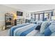 Comfortable bedroom featuring two beds, storage, dining area and access to outdoor balcony at 7200 N Ocean Blvd. # 431, Myrtle Beach, SC 29572