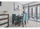 Dining area with seating for four, with balcony access, natural light, and views of the surrounding condos at 7200 N Ocean Blvd. # 431, Myrtle Beach, SC 29572