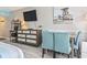 Living area with dining table, seating for four, media center, and coastal-themed artwork at 7200 N Ocean Blvd. # 431, Myrtle Beach, SC 29572
