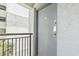 Unit door with electronic lock access, with stucco walls and metal railing, showing secure entry features at 7200 N Ocean Blvd. # 431, Myrtle Beach, SC 29572