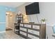 Corner of living area with a dresser, coffee bar, and TV, and wall decor at 7200 N Ocean Blvd. # 431, Myrtle Beach, SC 29572