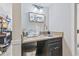 Wet bar with granite countertop, dark cabinetry, sink, and stainless steel trash can at 7200 N Ocean Blvd. # 431, Myrtle Beach, SC 29572