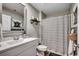 Well-lit bathroom with a modern vanity, framed mirror, and a stylish shower curtain at 777 Woodland Farms Circle, Aynor, SC 29511