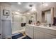Bright bathroom featuring double vanity, framed mirrors, and glass enclosed shower at 777 Woodland Farms Circle, Aynor, SC 29511