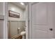 A quaint powder room shows stylish paneling and modern fixtures at 777 Woodland Farms Circle, Aynor, SC 29511