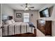 A cozy bedroom provides restful ambiance with natural light and modern fixtures at 777 Woodland Farms Circle, Aynor, SC 29511