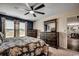 Cozy bedroom with dresser, and a doorway leading to the dining room at 777 Woodland Farms Circle, Aynor, SC 29511