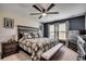 Well-lit bedroom with a dark accent wall, a large bed, and generous storage at 777 Woodland Farms Circle, Aynor, SC 29511