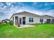 Charming home featuring a screened porch, well-maintained lawn, and inviting outdoor space at 777 Woodland Farms Circle, Aynor, SC 29511