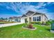 Manicured lawn featuring a charming single-story home with classic curb appeal on a sunny day at 777 Woodland Farms Circle, Aynor, SC 29511