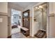 Hallway featuring a drop zone bench, and entryways to a laundry room and bedroom at 777 Woodland Farms Circle, Aynor, SC 29511