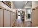 Inviting hallway with beautiful wood floors and stylish wall trim, leading to living spaces at 777 Woodland Farms Circle, Aynor, SC 29511