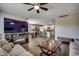 Open-concept living space with sleek fireplace, hardwood floors, and adjoining kitchen at 777 Woodland Farms Circle, Aynor, SC 29511