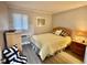 Inviting bedroom with a full-size bed, dresser, and warm natural lighting at 9501 Shore Dr. # D-237, Myrtle Beach, SC 29572