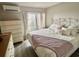 Comfortable bedroom featuring a queen size bed, white dresser, and access to the deck at 9501 Shore Dr. # D-237, Myrtle Beach, SC 29572