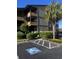 Condo's exterior featuring a palm tree, landscaping and convenient handicap parking at 9501 Shore Dr. # D-237, Myrtle Beach, SC 29572