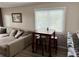 Comfortable living room with a table set by the window, providing a cozy dining area at 9501 Shore Dr. # D-237, Myrtle Beach, SC 29572