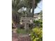 Community sign for Mariners Cove surrounded by lush greenery and palm trees at 9501 Shore Dr. # D-237, Myrtle Beach, SC 29572