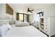 Bright bedroom featuring two beds, light wood floors, balcony access and small dining table at 9550 Shore Dr. # 531, Myrtle Beach, SC 29572