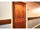 Condo unit door in hallway with wood trim at 9550 Shore Dr. # 531, Myrtle Beach, SC 29572