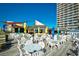 Outdoor restaurant area with umbrellas, tables and chairs at 9550 Shore Dr. # 531, Myrtle Beach, SC 29572