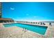 Large pool overlooking the ocean with lounge chairs and an adjacent bar at 9550 Shore Dr. # 531, Myrtle Beach, SC 29572