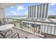 Relaxing balcony with seating offering scenic views of the beach, ocean, and the high-rise building at 9820 Queensway Blvd. # 704, Myrtle Beach, SC 29572