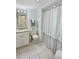 Cozy bathroom featuring a shower with a curtain, a vanity, and a toilet at 9820 Queensway Blvd. # 704, Myrtle Beach, SC 29572